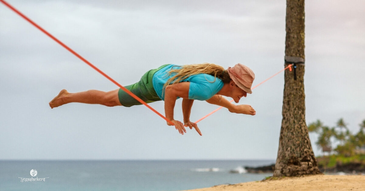 slackliner doing a yoga pose