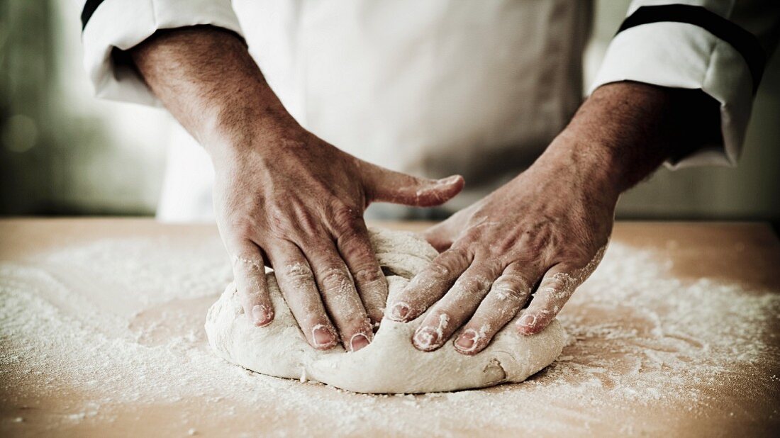 person_kneading_bread_dough