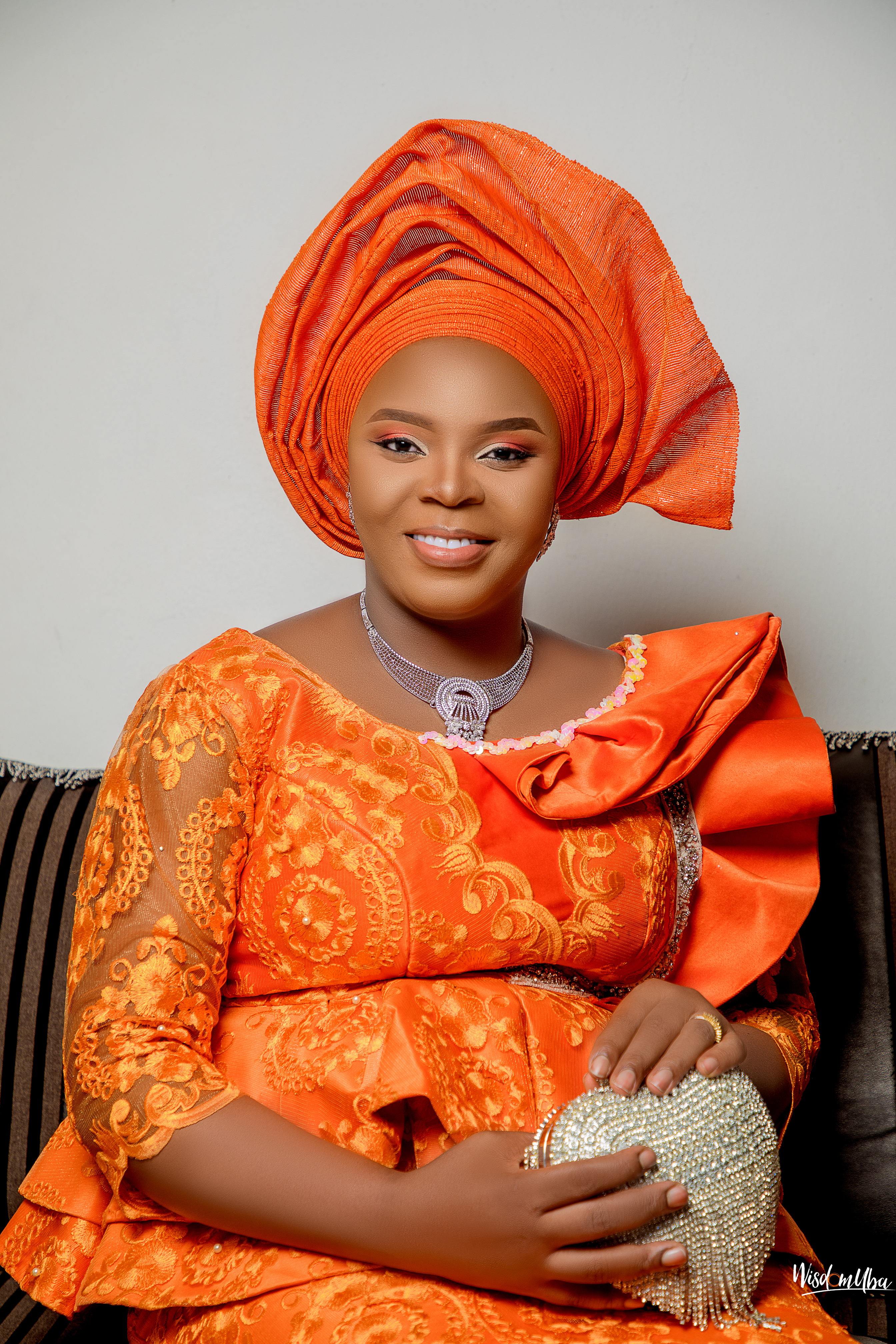 A beautiful African woman using gele