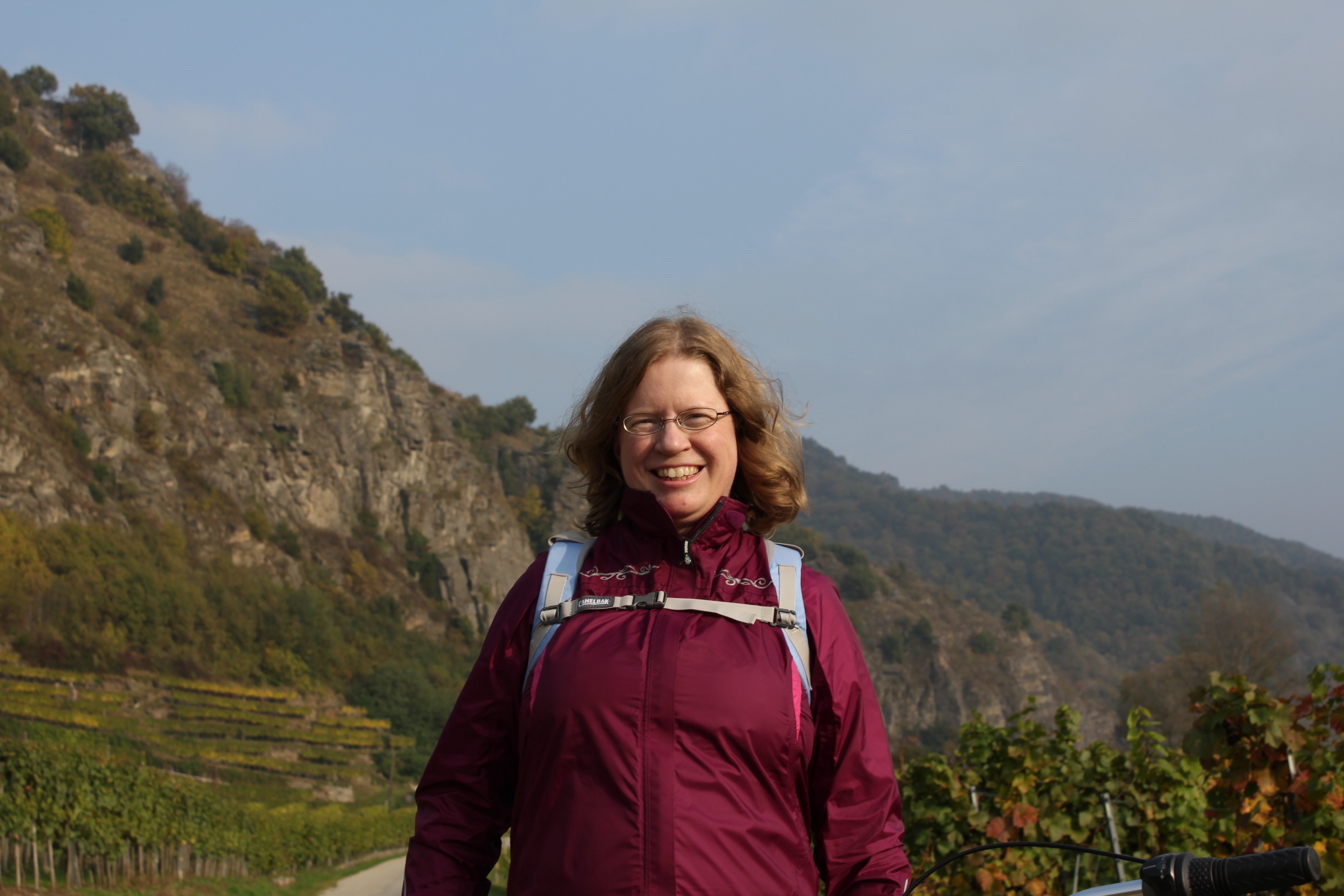 Woman cyclist standing in the Wachau Valley