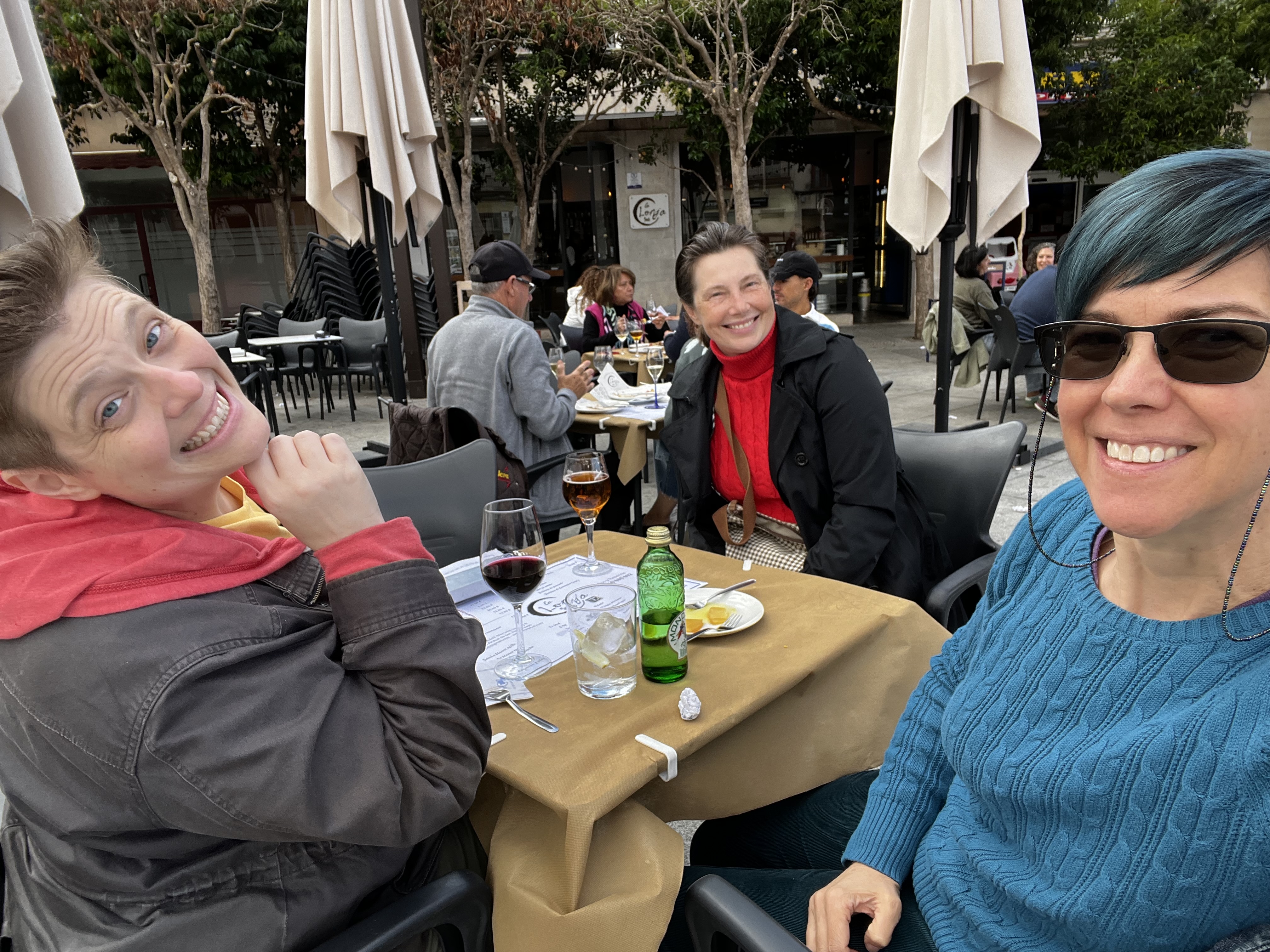 three women eating outside
