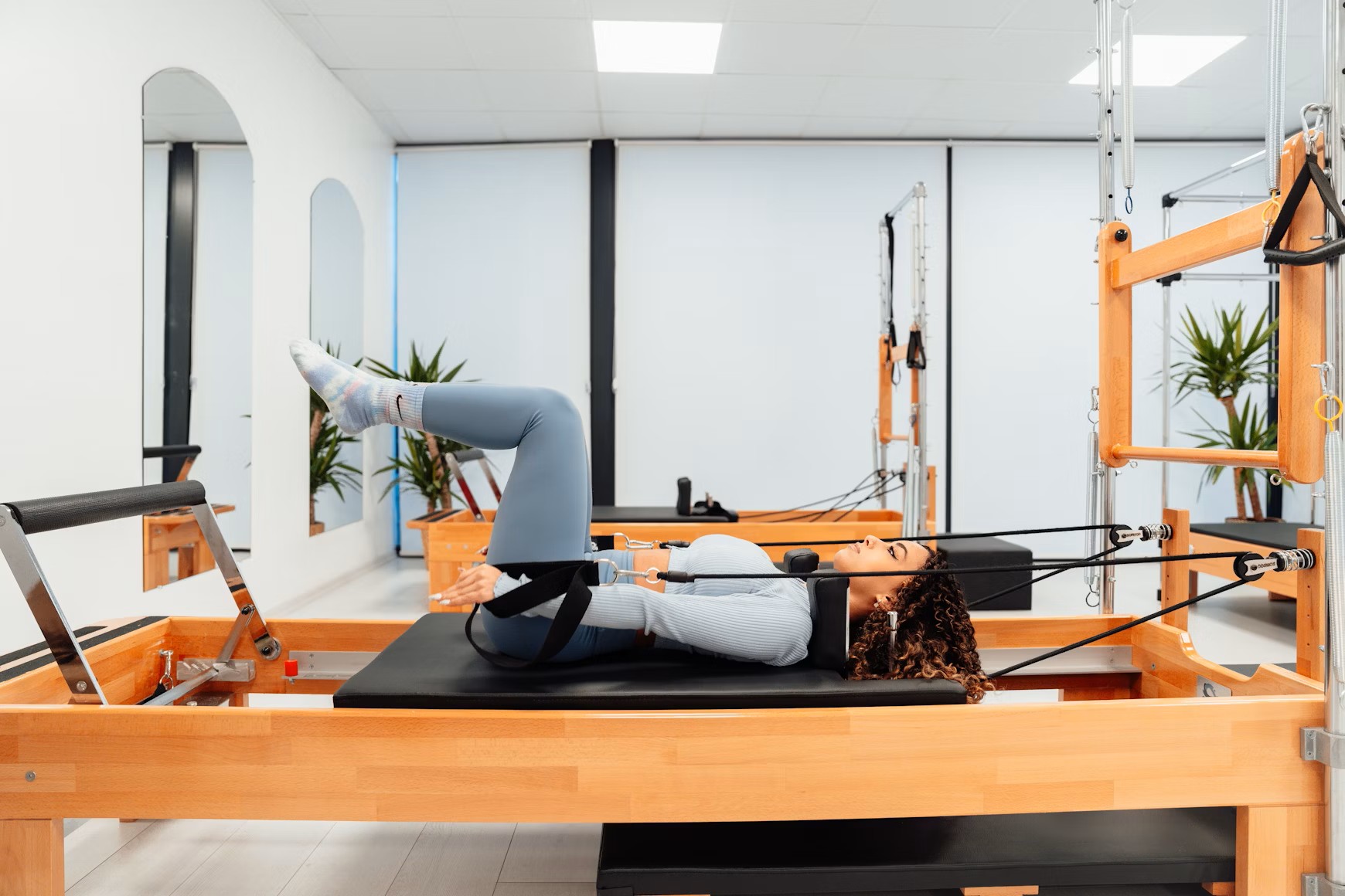 Woman doing Pilates on Reformer