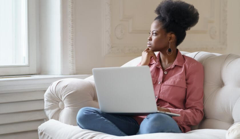 Woman working comfortably on a couch