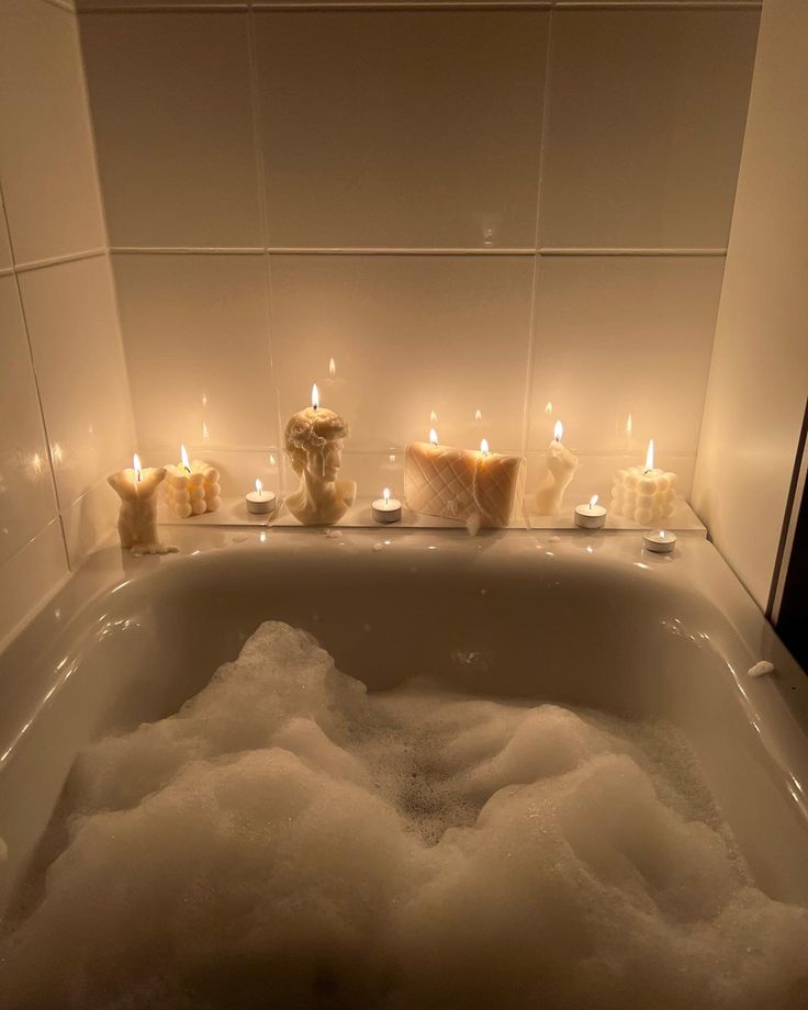 Relaxing bubble bath with soothing candles