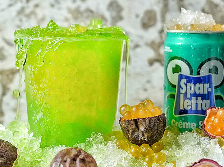 Glass of Creme Soda, set on ice with fruit