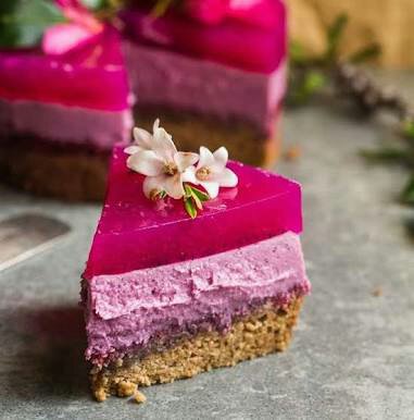 Thick slice of pink/purple cake with golden crust