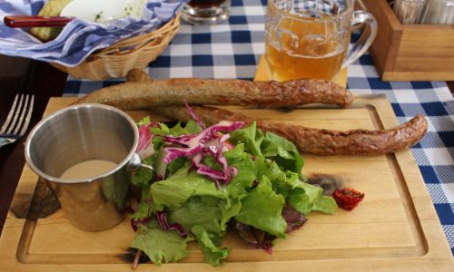 
                Sausages and beer in Riga