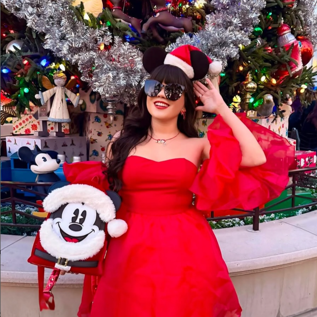 Gril in red dress with Mickey Bookbag