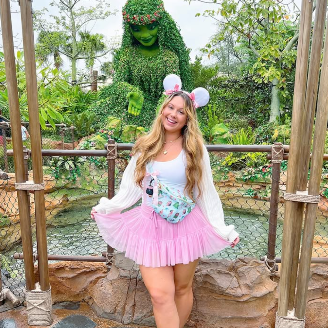 Girl Disney Bounding in Pink skirt and White sweater
