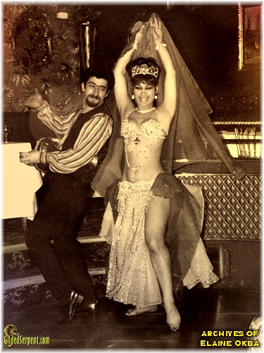 vintage photograph of a bellydancer on stage with a man