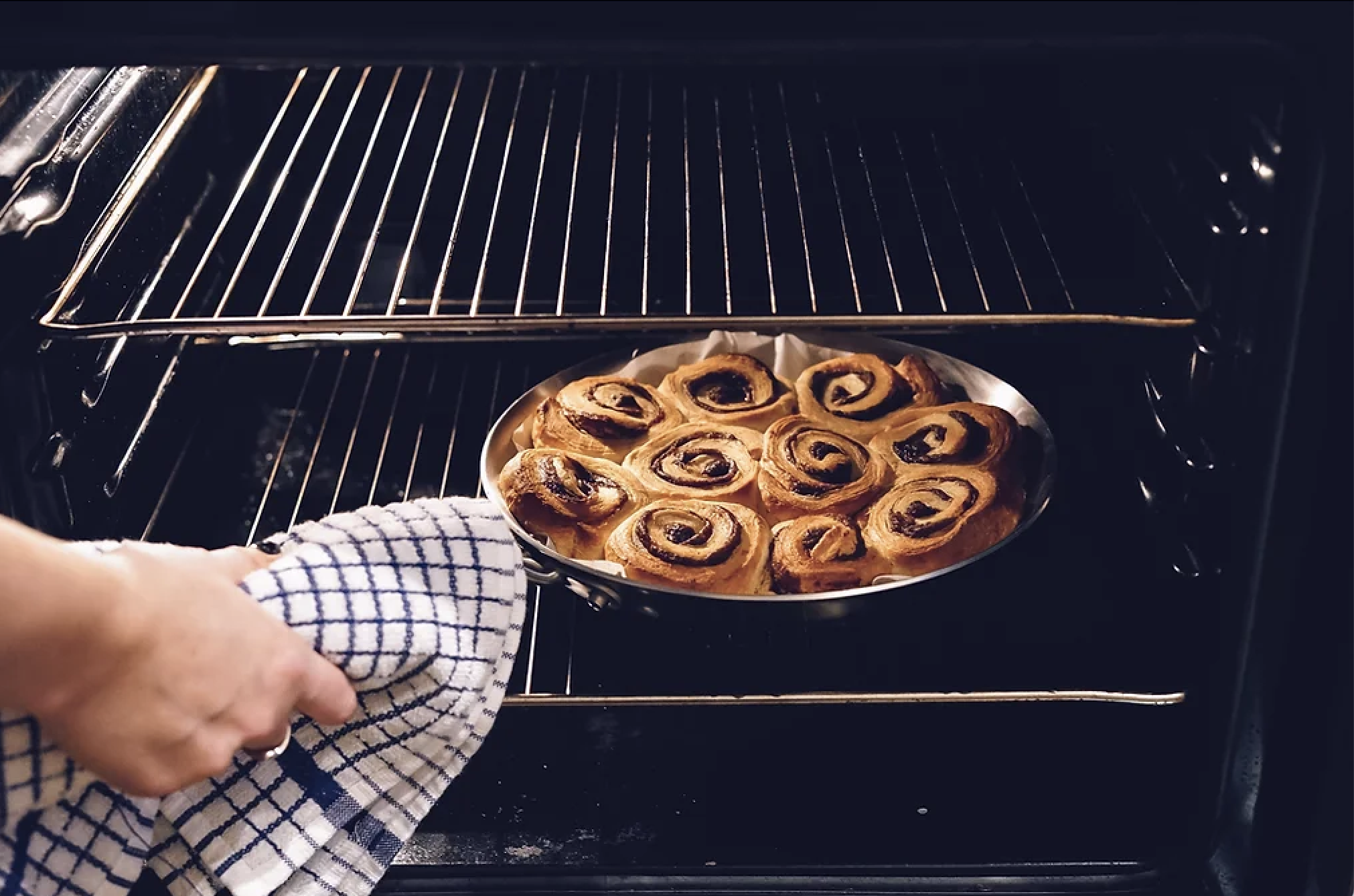Pulling Cinnamon Rolls Out of the Oven