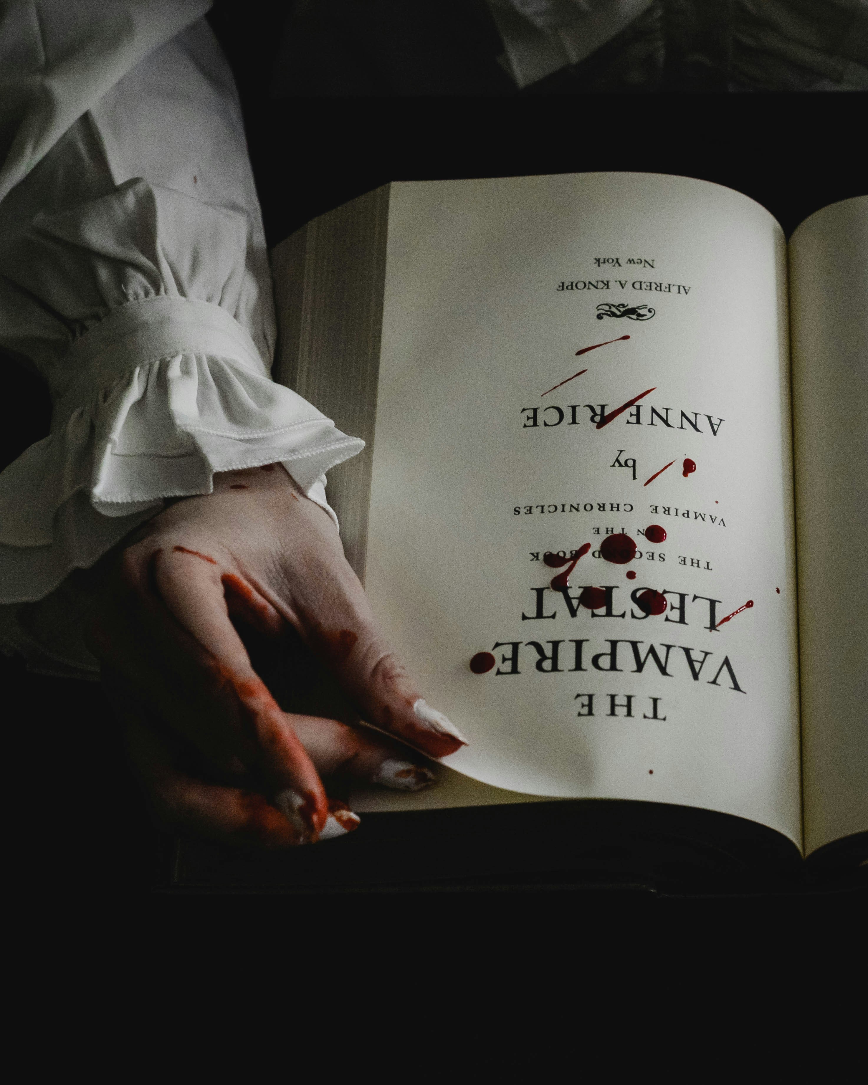 The vampire book with blood on the page