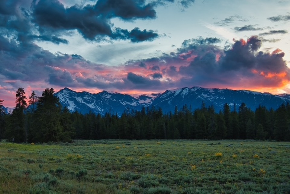 mountains at sunset with pink and blue colors