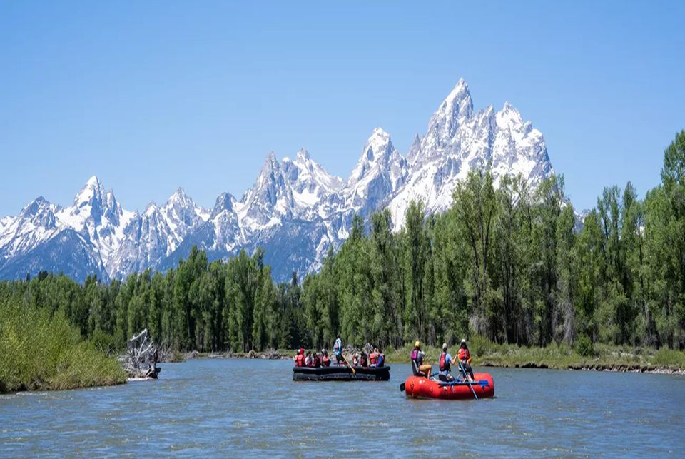red boat with people in river