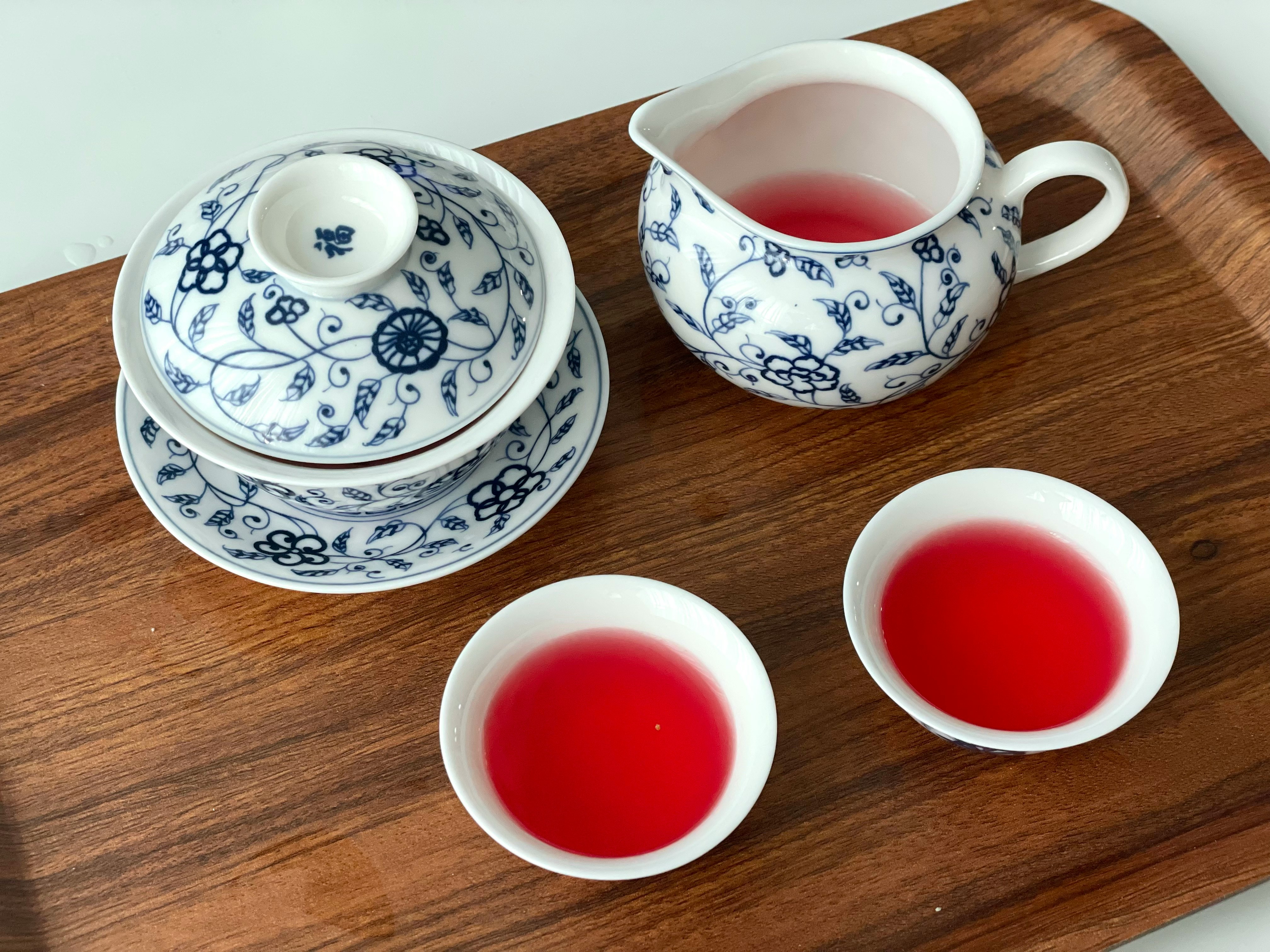 A traditional Japanese tea ceremony with tea being served in a peaceful setting.