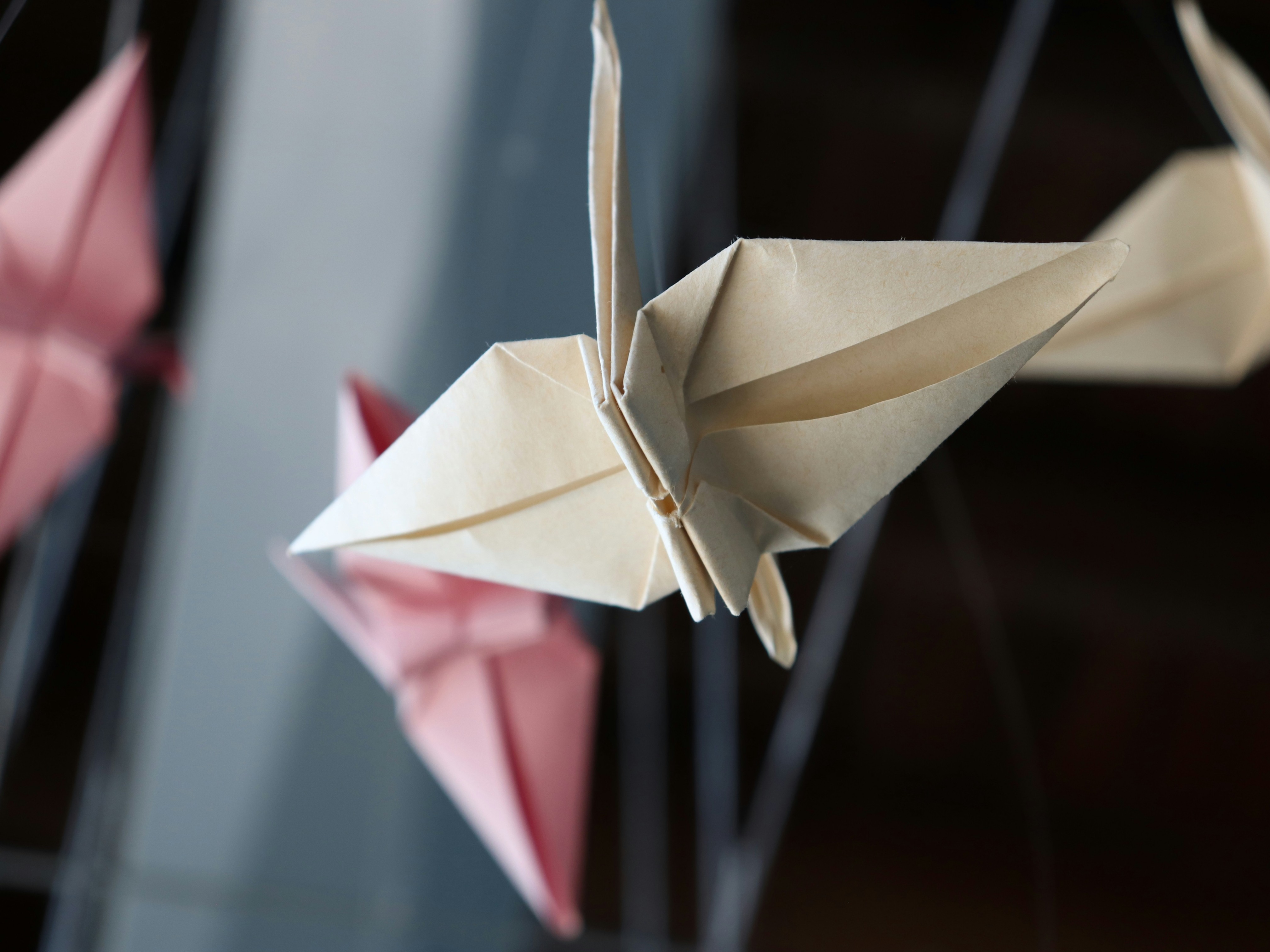 Close-up of a paper crane, a symbol of peace in Japanese culture.