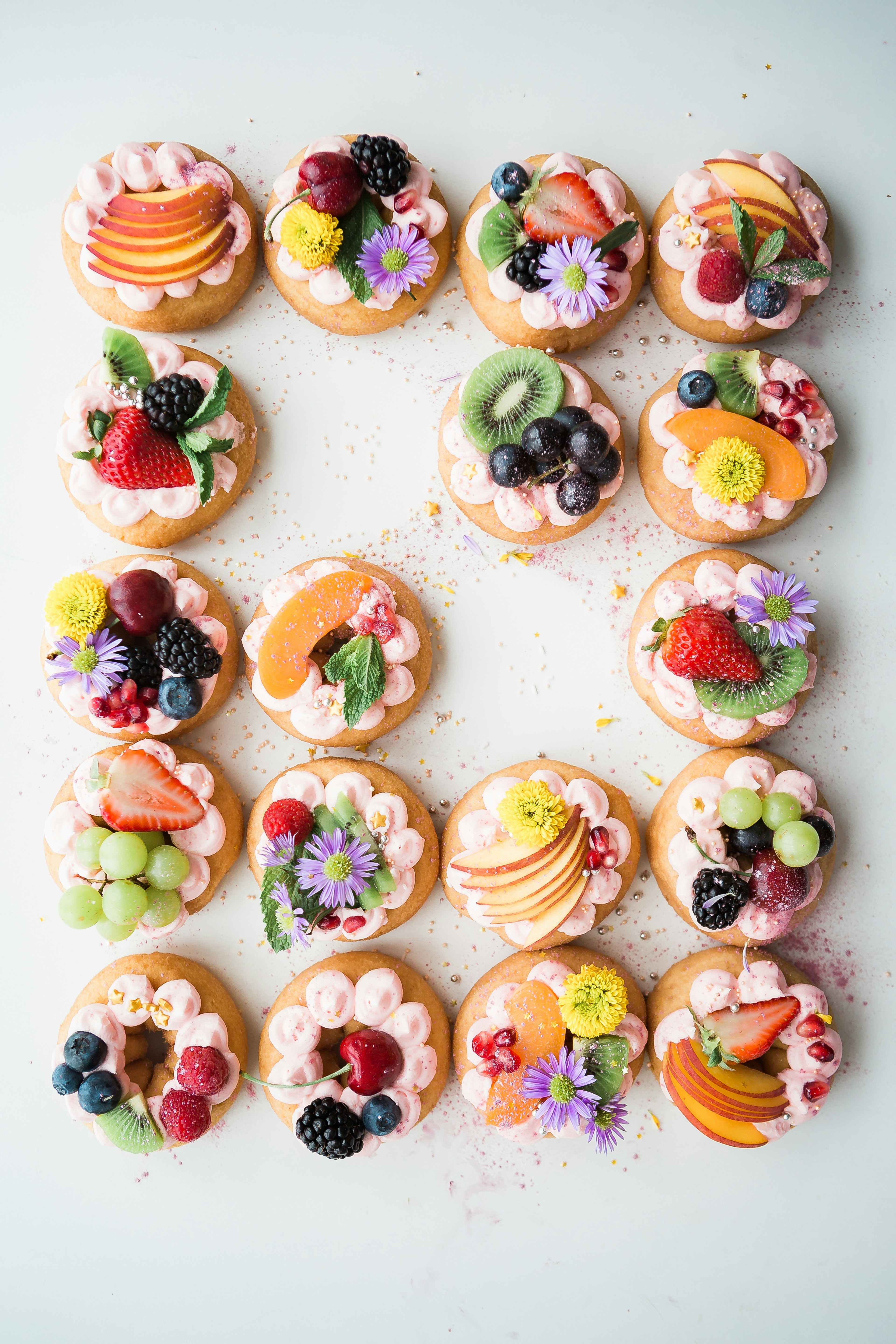 Cookies topped with cream and a variety of fruits