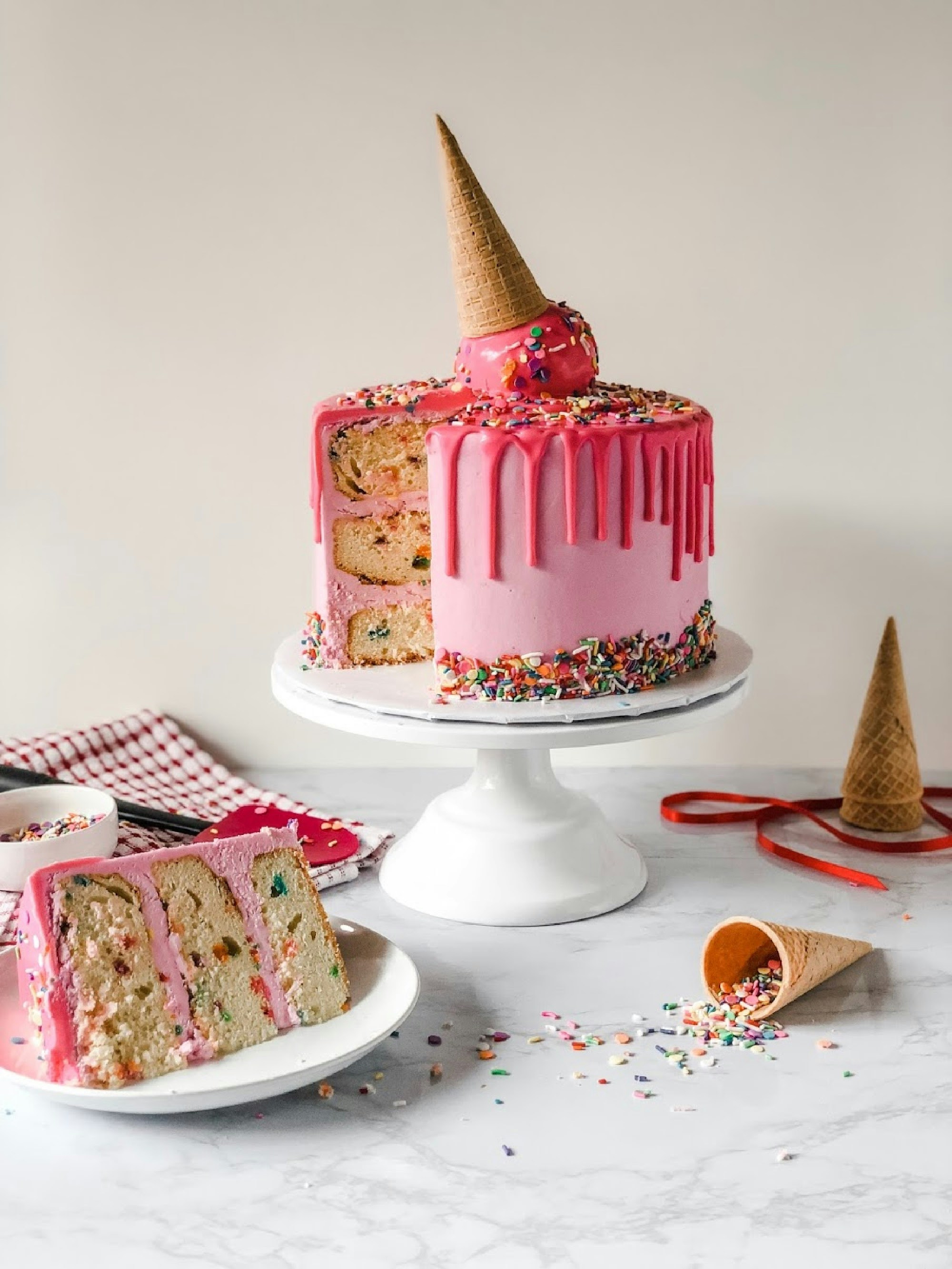 pink cake decorated with sprinkles