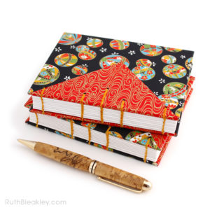 Hand‑stitched Temari ball journal