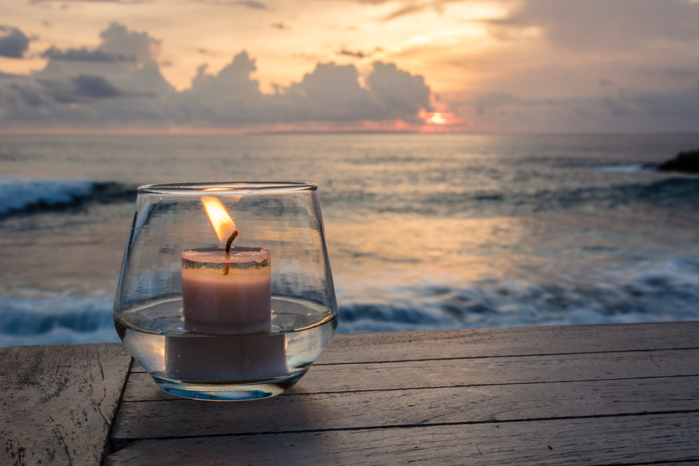 a candle at the beach