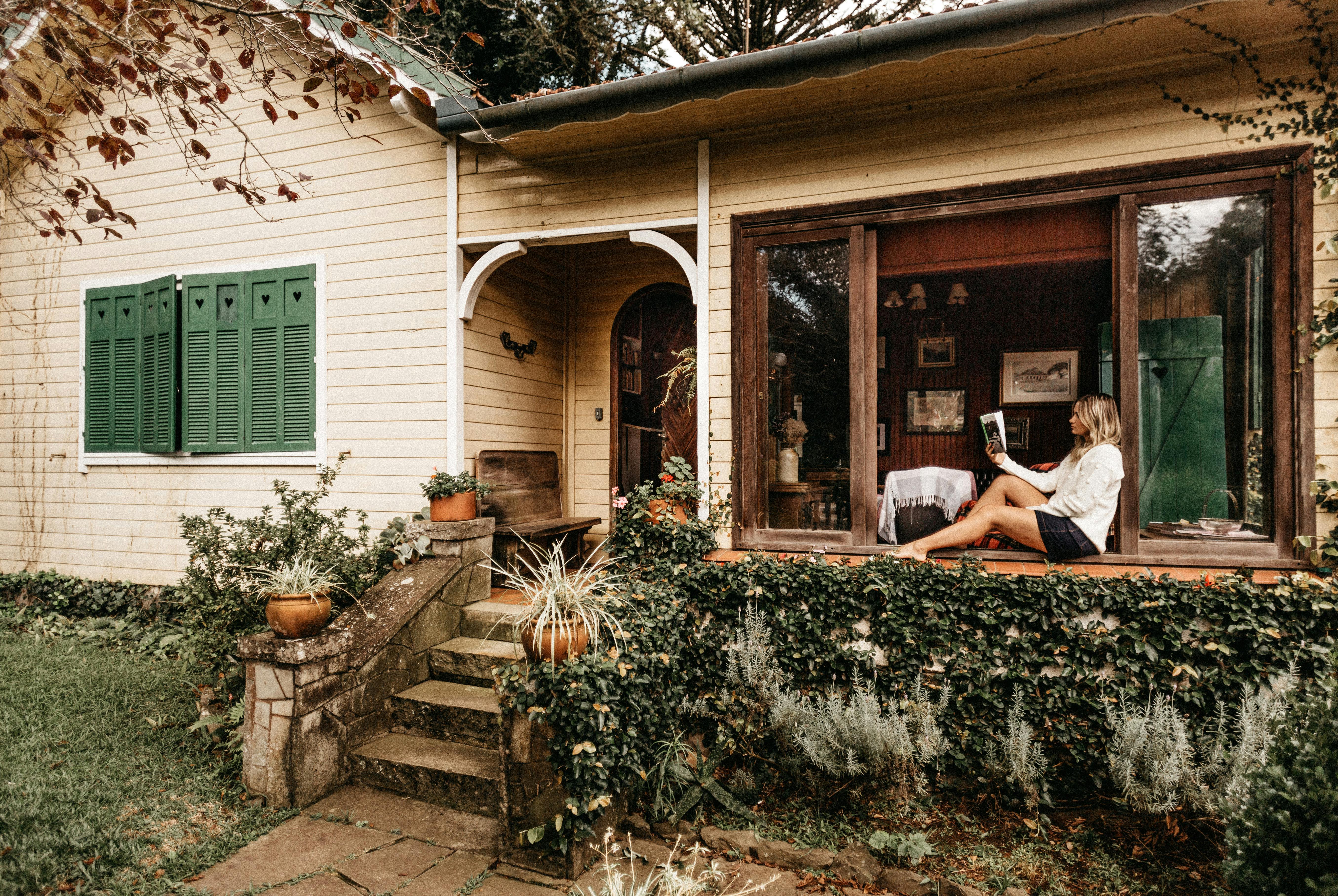 girl reading on a porch
