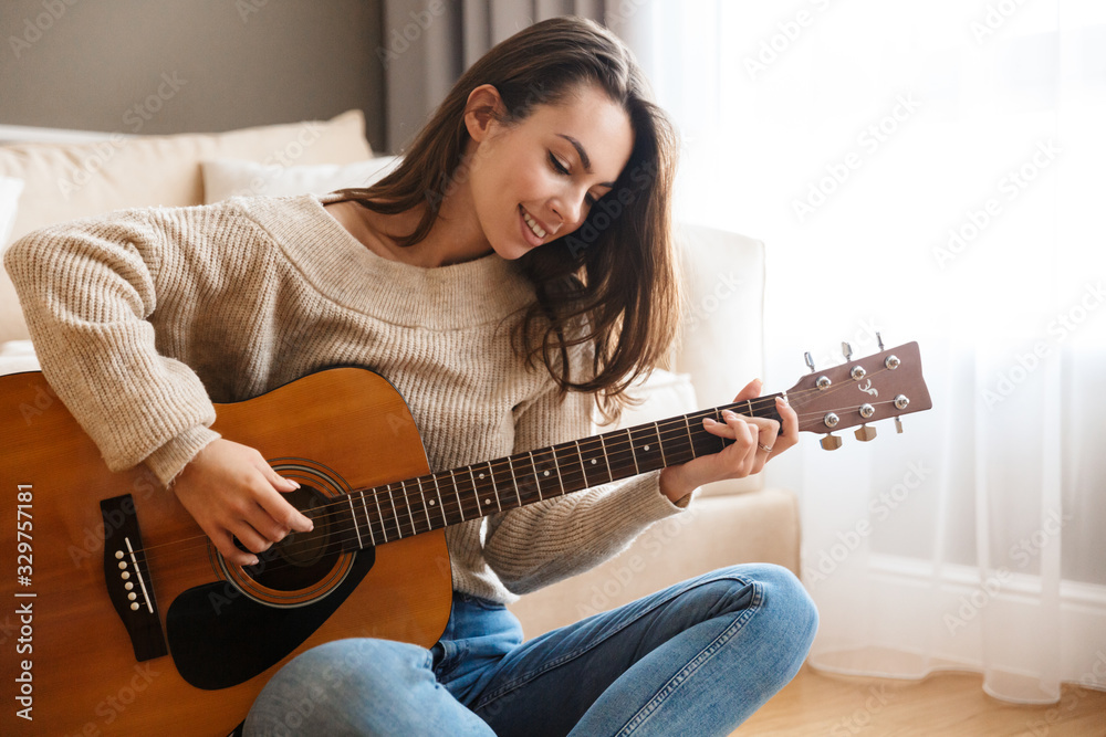 woman playing guitar