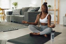 Woman meditating on yoga mat