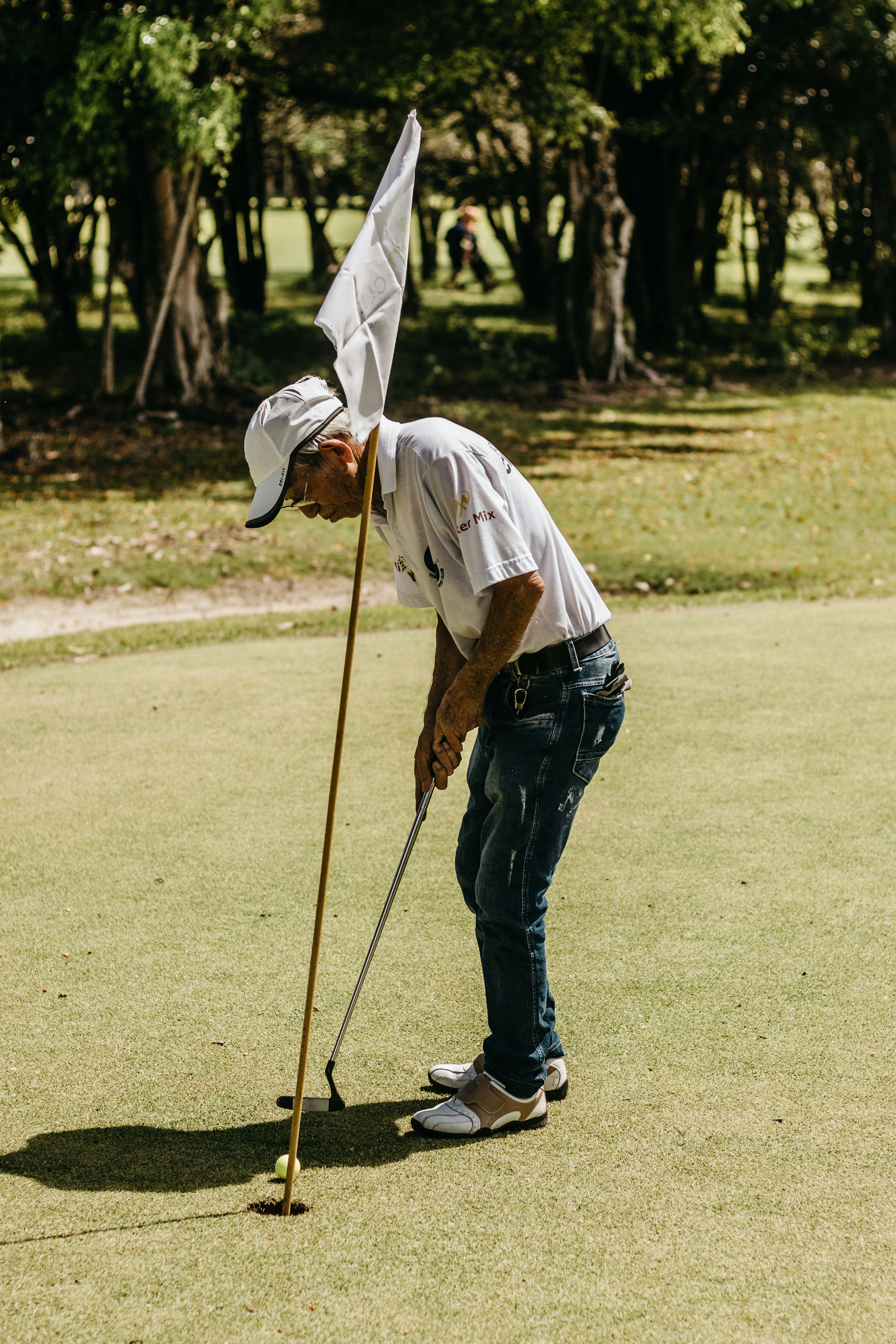 Old man putting