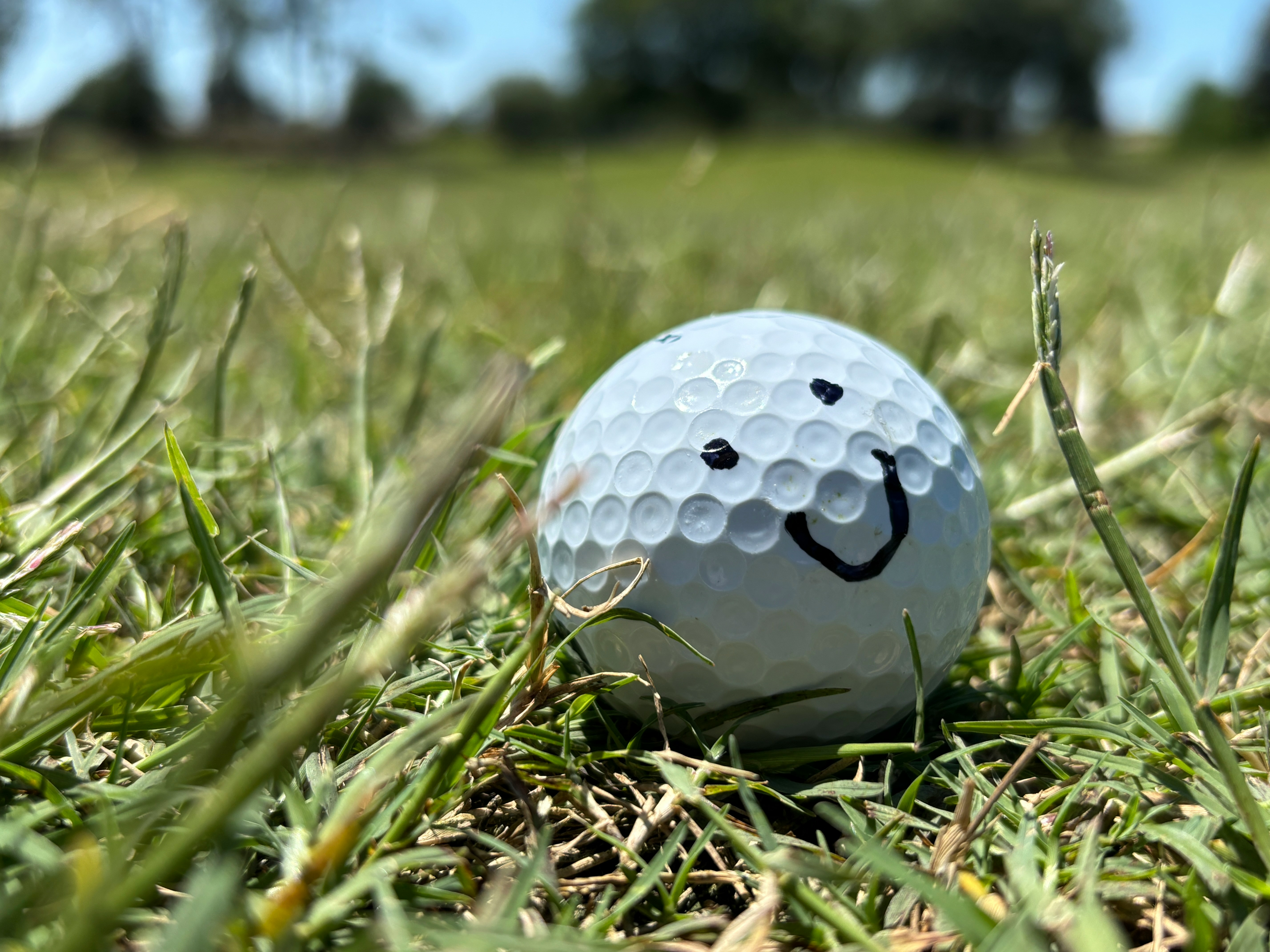 Smiley face on golf ball