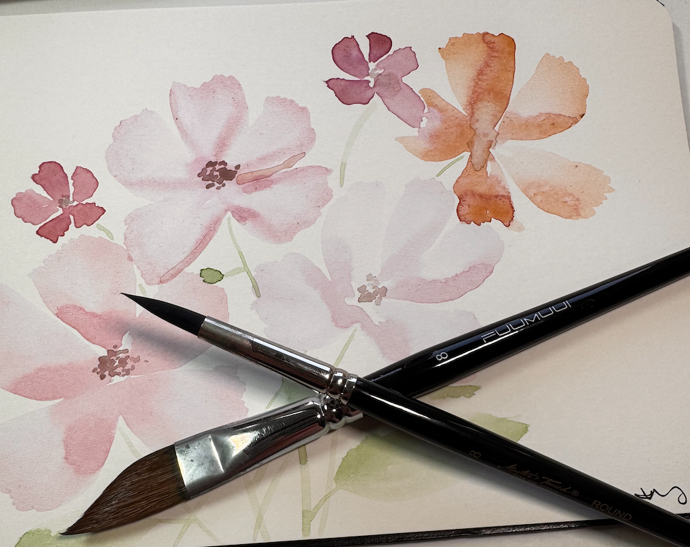 Watercolor brushes on background