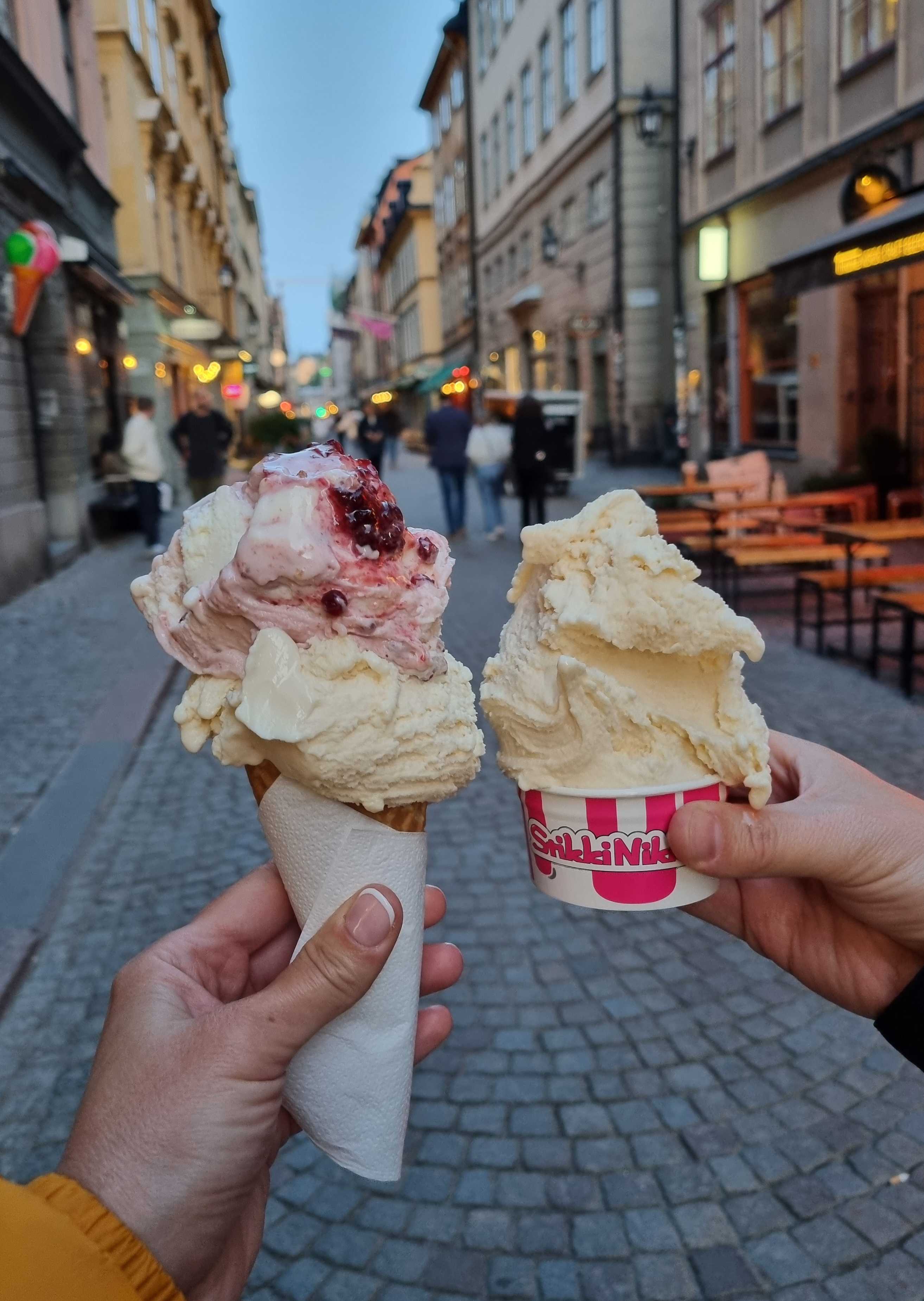 A cone and a tub of gelato