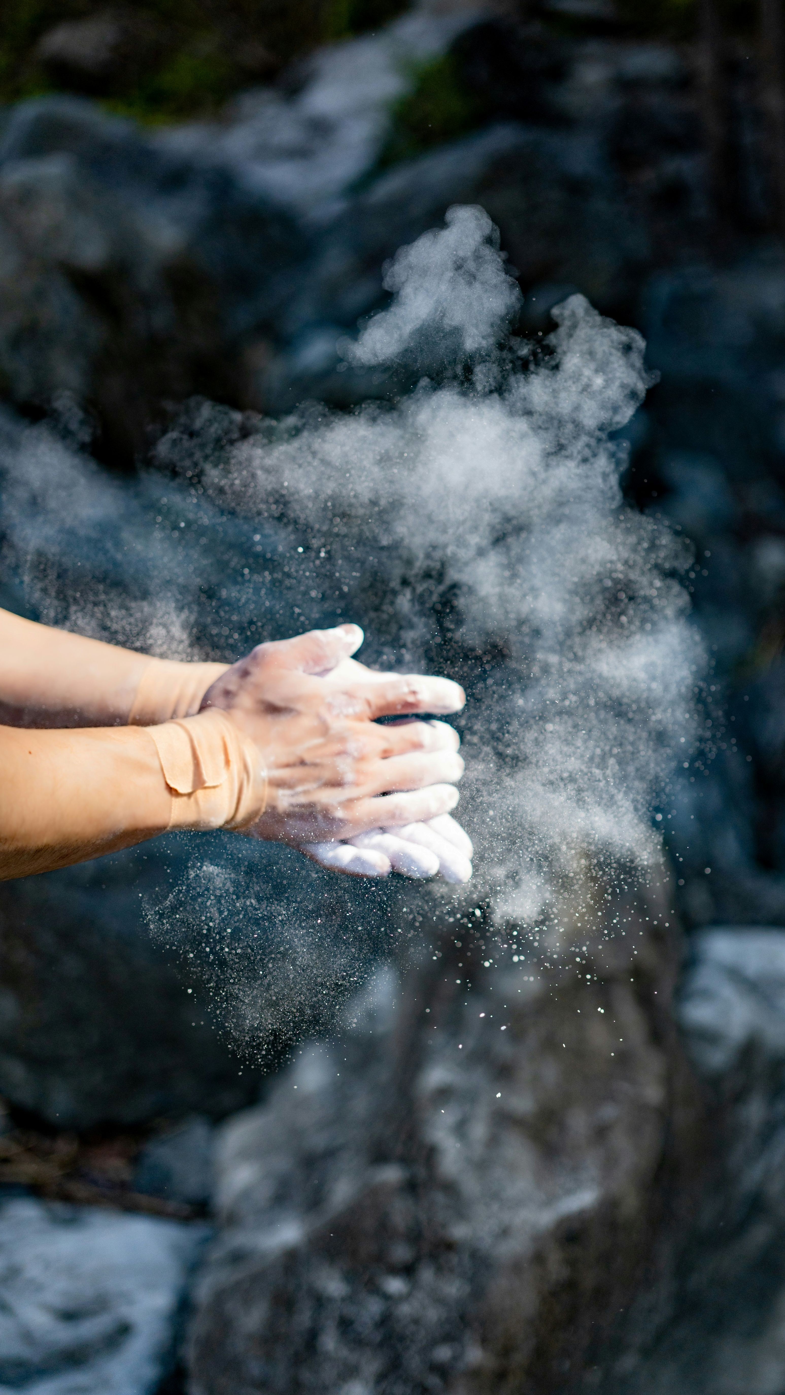 chalk clouds from hands clapping