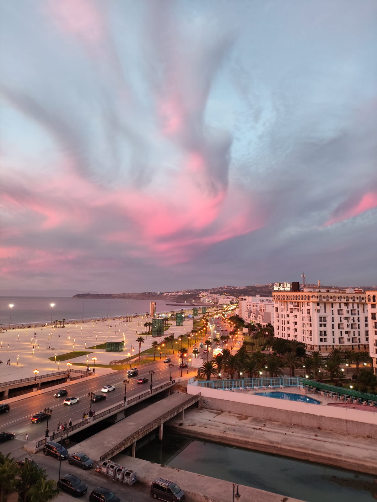 Sea view with palm-lined promenade on the Tangier Corniche