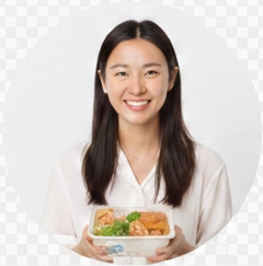 A happy female customer holding up a meal kit