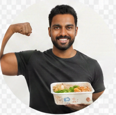 A happy male customer flexing his bicep while holding up a meal kit