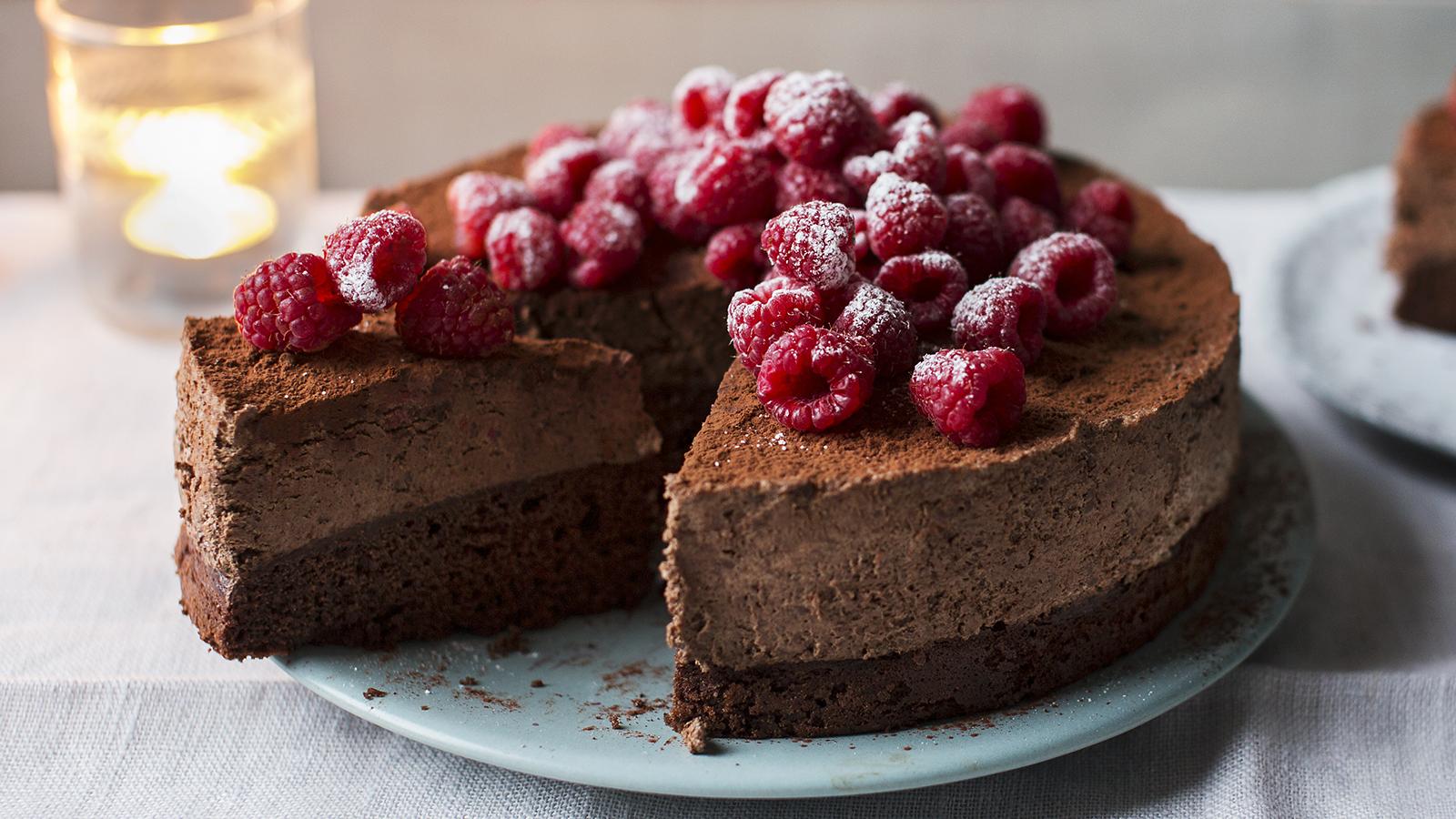chocolate cake topped with raspberries