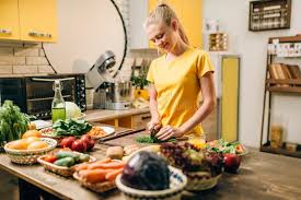 A woman cooking healthy organic food