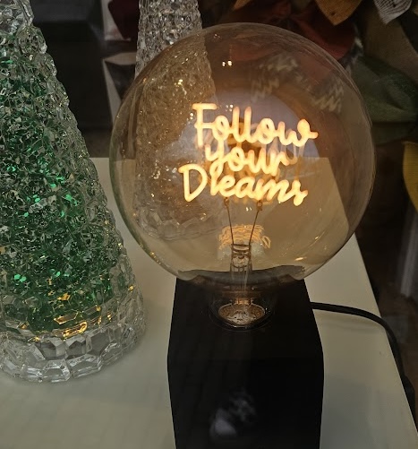 Phrase 'Follow your dreams' placed in an urban context