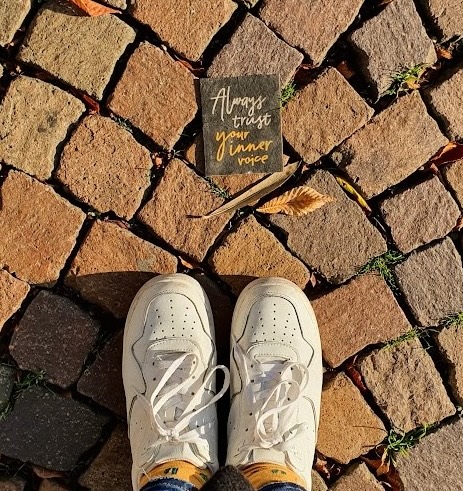 Text 'Inner voice' on the ground of a street