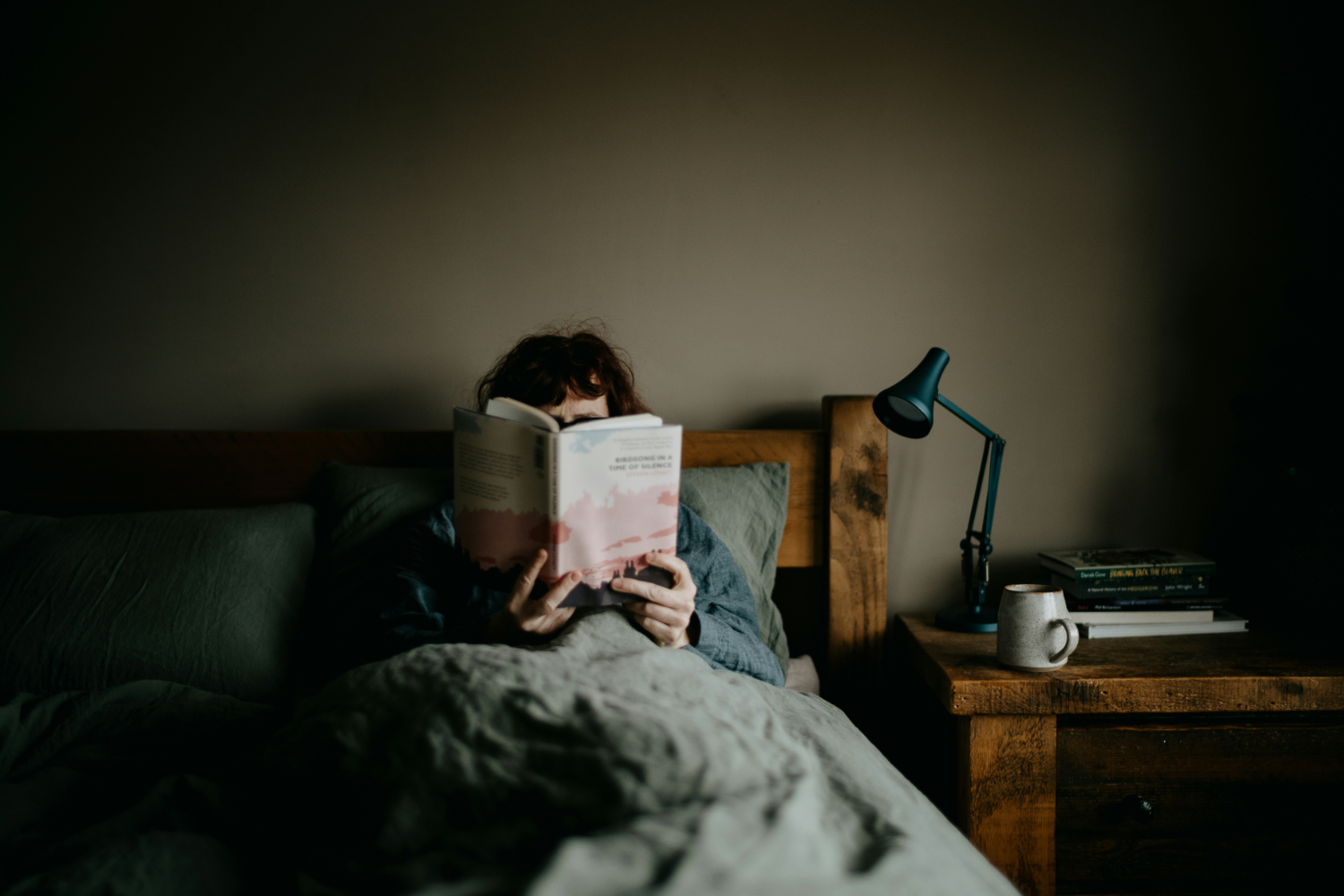 woman reading in bed