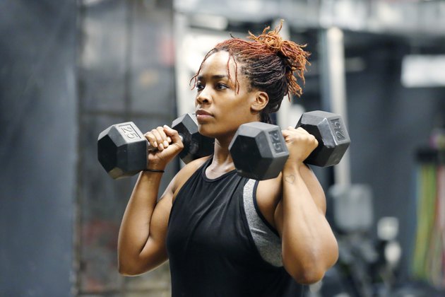 Woman Lifting Dumbbells