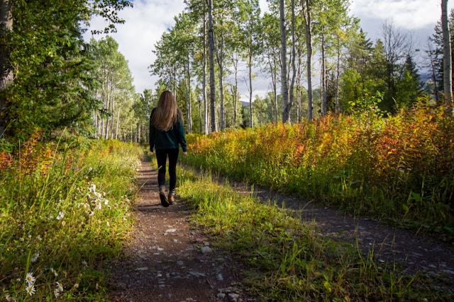 woman walking in woods