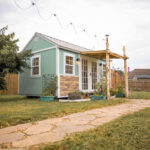 10x16 shed home office exterior with landscaping and pavers