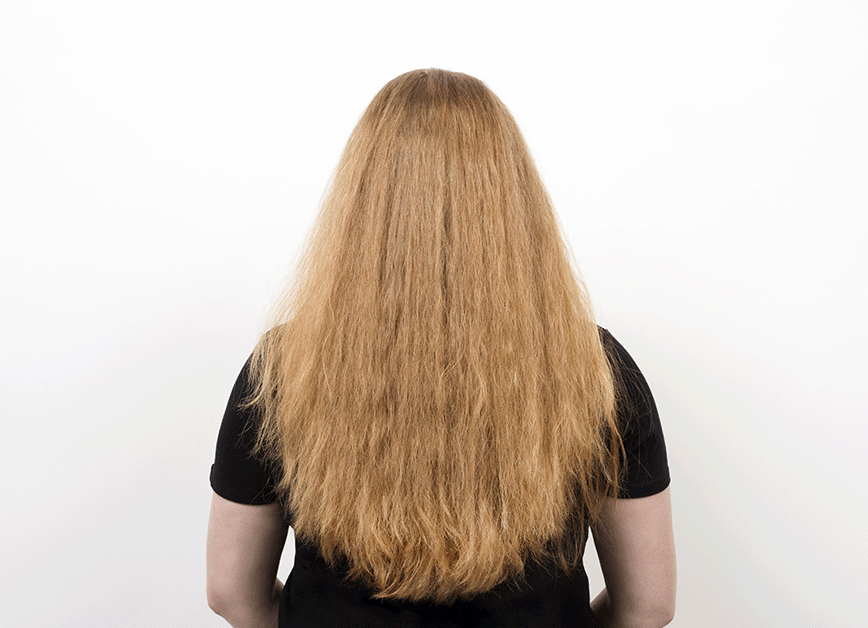 Use the GLOSSIE hot brush to straighten hair