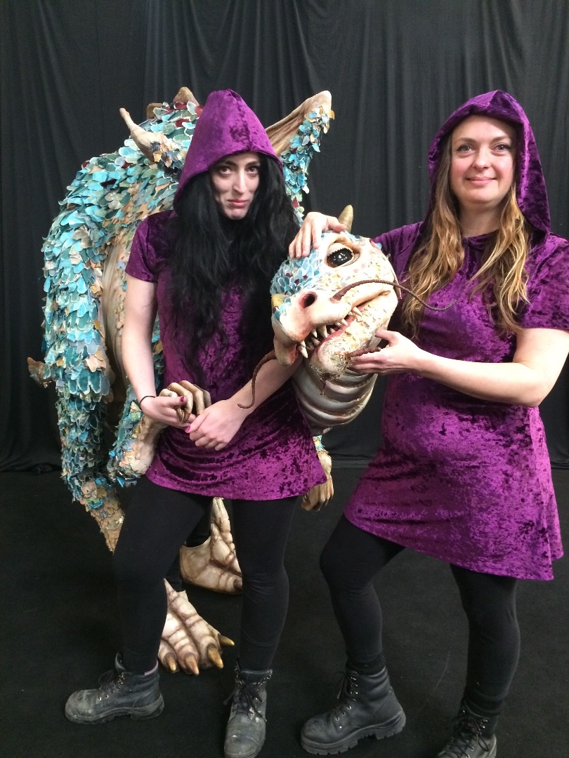 Dinosaur makers in purple velvet battle dresses