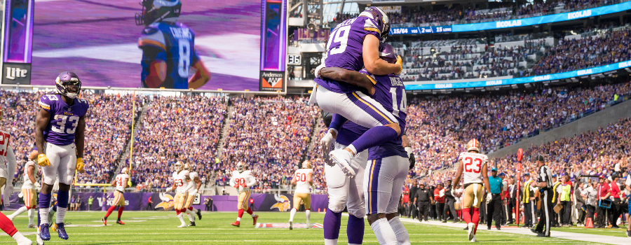 Minnesota Vikings wide receiver Adam Thielen (19) celebrates with wide receiver Stefon Diggs (14) after his touchdown in the second quarter against San Francisco 49ers at U.S. Bank Stadium.