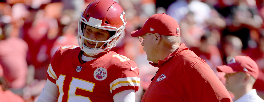 Kansas City Chiefs quarterback Patrick Mahomes (15) talks with head coach Andy Reid