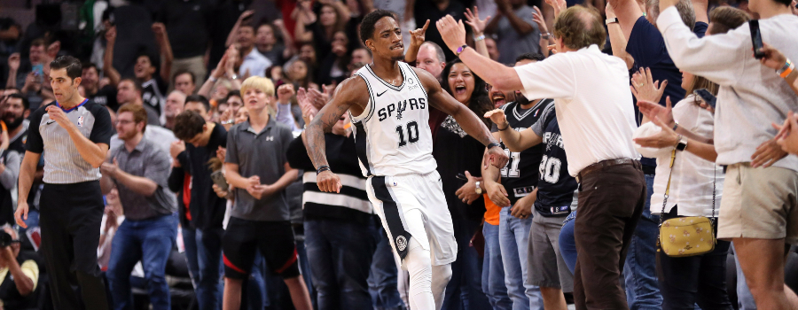 San Antonio Spurs shooting guard DeMar DeRozan (10) reacts after a shot during overtime against the Dallas Mavericks at AT&T Center.