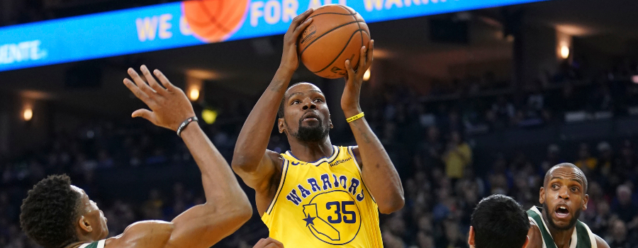 Golden State Warriors forward Kevin Durant (35) shoots the basketball against Milwaukee Bucks forward Giannis Antetokounmpo (34) and forward Ersan Ilyasova (77) during the second quarter at Oracle Arena.