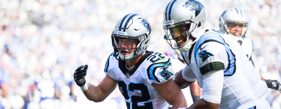 Carolina Panthers running back Christian McCaffrey (22) celebrates with quarterback Cam Newton (1) after scoring a touchdown in the fourth quarter at Bank of America Stadium.